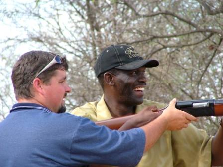 man shooting clay pigeon